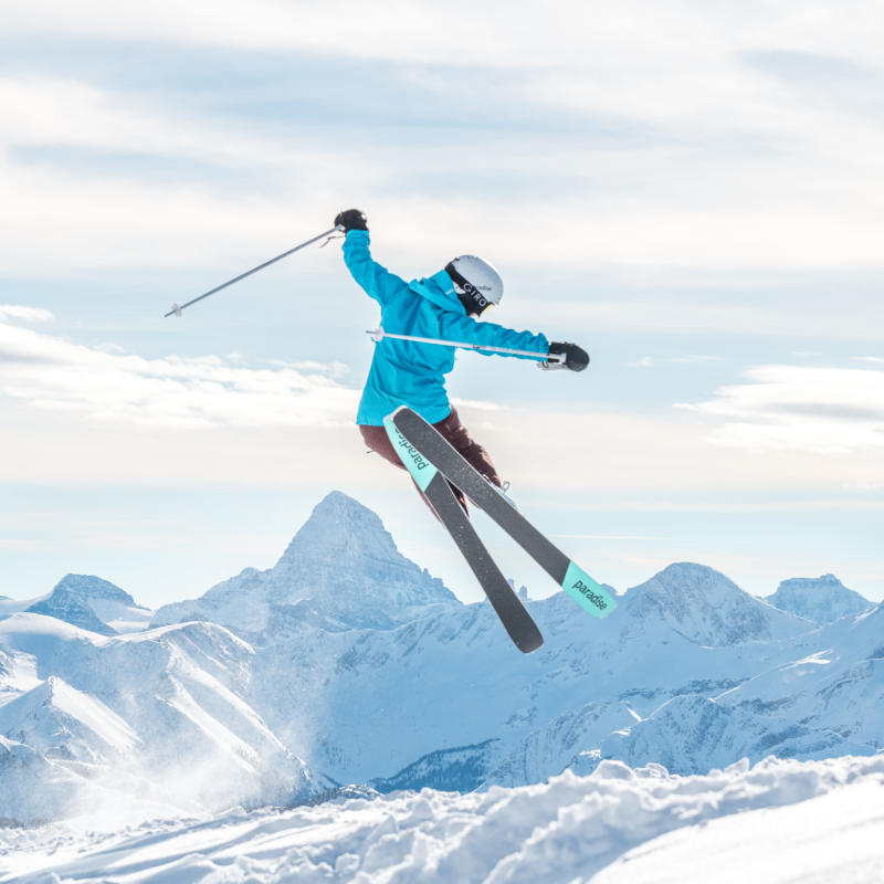 Female skier getting air time on VICE 97s at Banff Sunshine Village. 